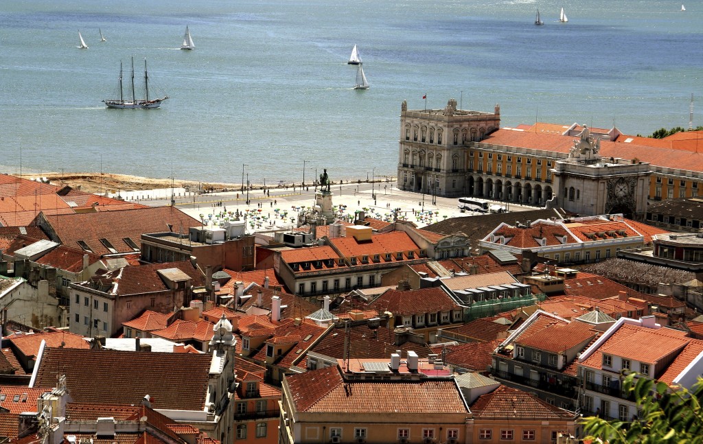Bird way of central Lisbon with red roofs and river embankment