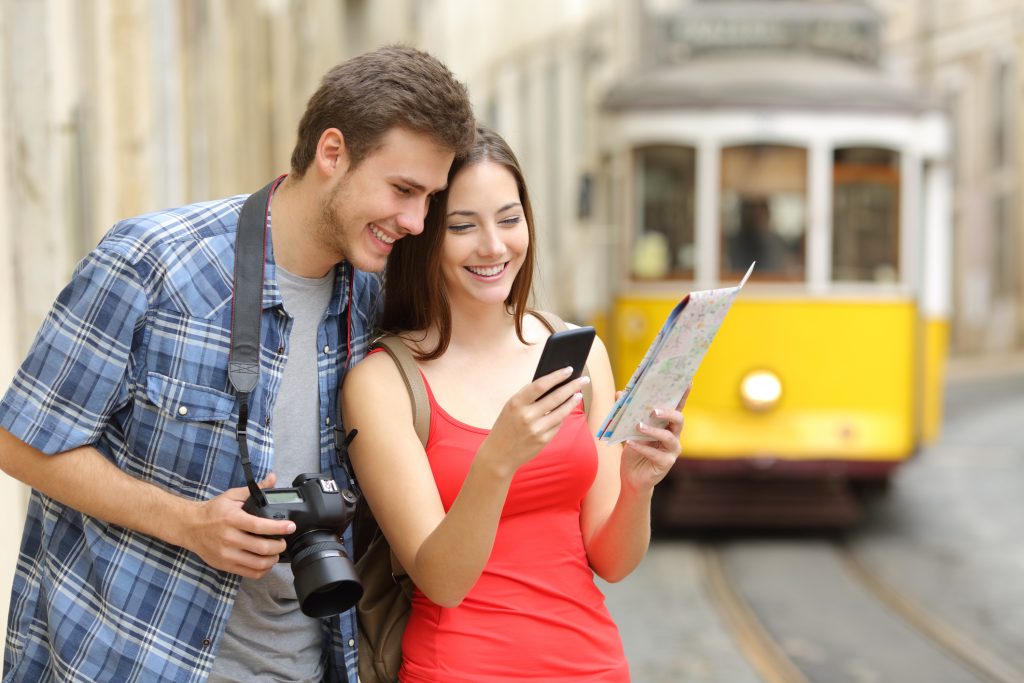 Couple of tourists consulting guide in portugal